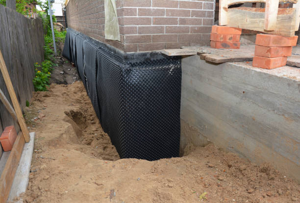Happy homeowners after waterproofing job in Terre Haute